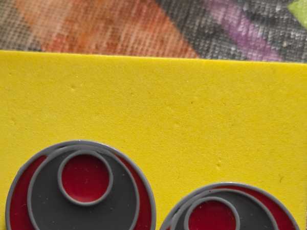 Red and Gray Concentric Circle Earrings with Yellow Background