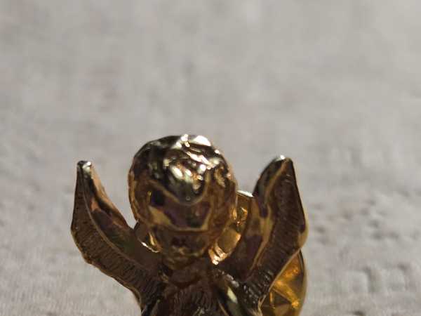 Ornate Gold Angel Lapel Pin with Amethyst Accent