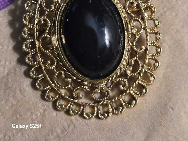 Elegant Gold Oval Black Stone Filigree Brooch